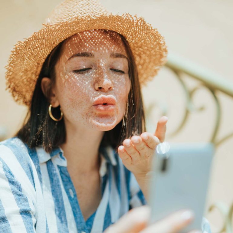 woman-making-a-video-call-from-her-phone-J8L7AKF.jpg
